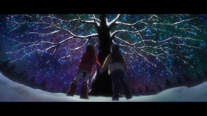 Image of Kayo and Satoru standing in front of a tree