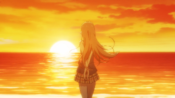 Image of Neko with her back turned as she watches the beach sunset