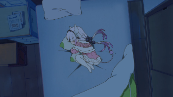 Image of Kanna curled up in bed