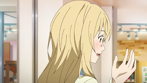 Kaori lookingat her hand as she talks about the girl they helped