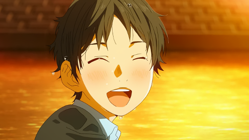 Kousei laughing after jumping in the water